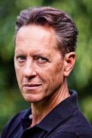 Richard E. Grant is Dr. Rice